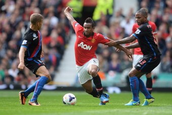 MANCHESTER, ENGLAND - SEPTEMBER 14:  Anderson of Manchester United takes on Dwight Gayle (L) and Jason Puncheon of Crystal Palace (R) during the Barclays Premier League match between Manchester United and Crystal Palace at Old Trafford on September 14, 20