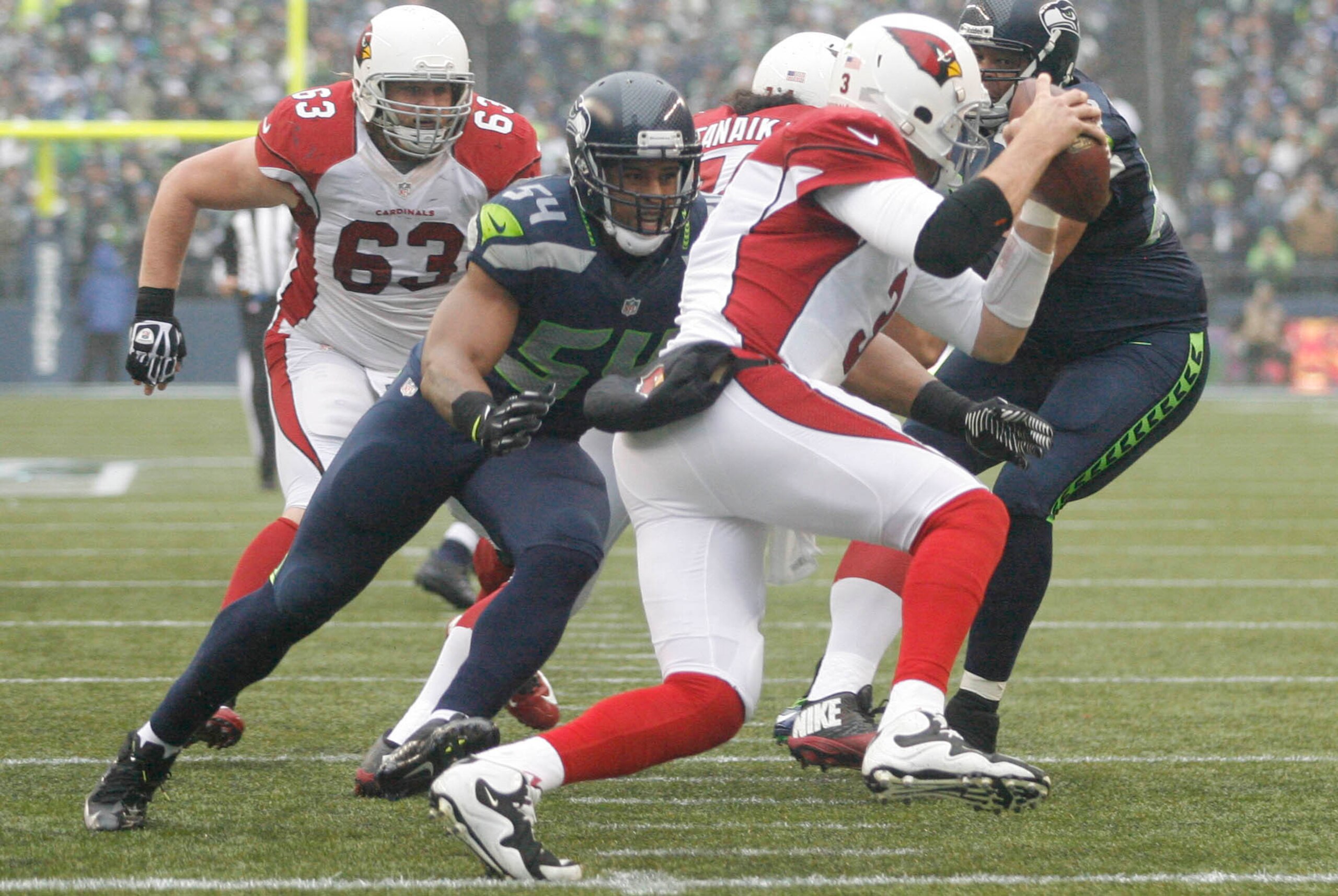 Dec 22, 2013; Seattle, WA, USA; Seattle Seahawks middle linebacker Bobby Wagner (54) sacks Arizona Cardinals quarterback Carson Palmer (3) during the second quarter at CenturyLink Field. Mandatory Credit: Joe Nicholson-USA TODAY Sports