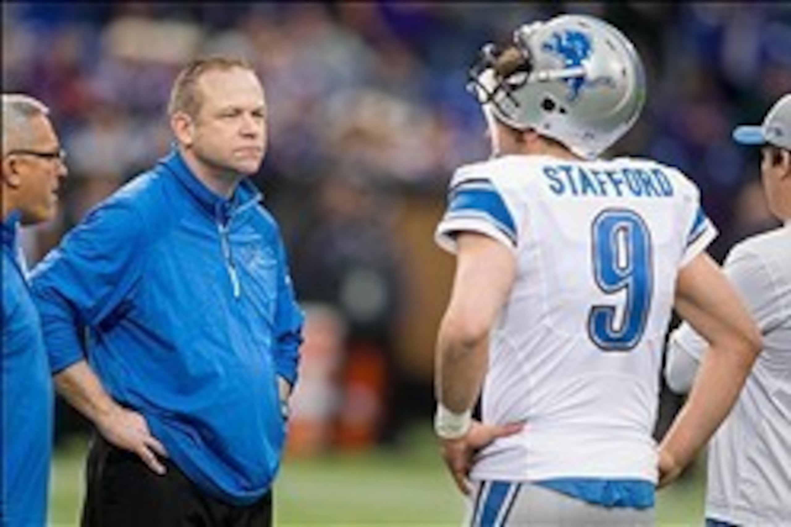 Dec 29, 2013; Minneapolis, MN, USA; Detroit Lions offensive coordinator Scott Linehan talks with quarterback Matthew Stafford (9) before the game with the Minnesota Vikings at Mall of America Field at H.H.H. Metrodome. The Vikings win 14-13. Mandatory Cre