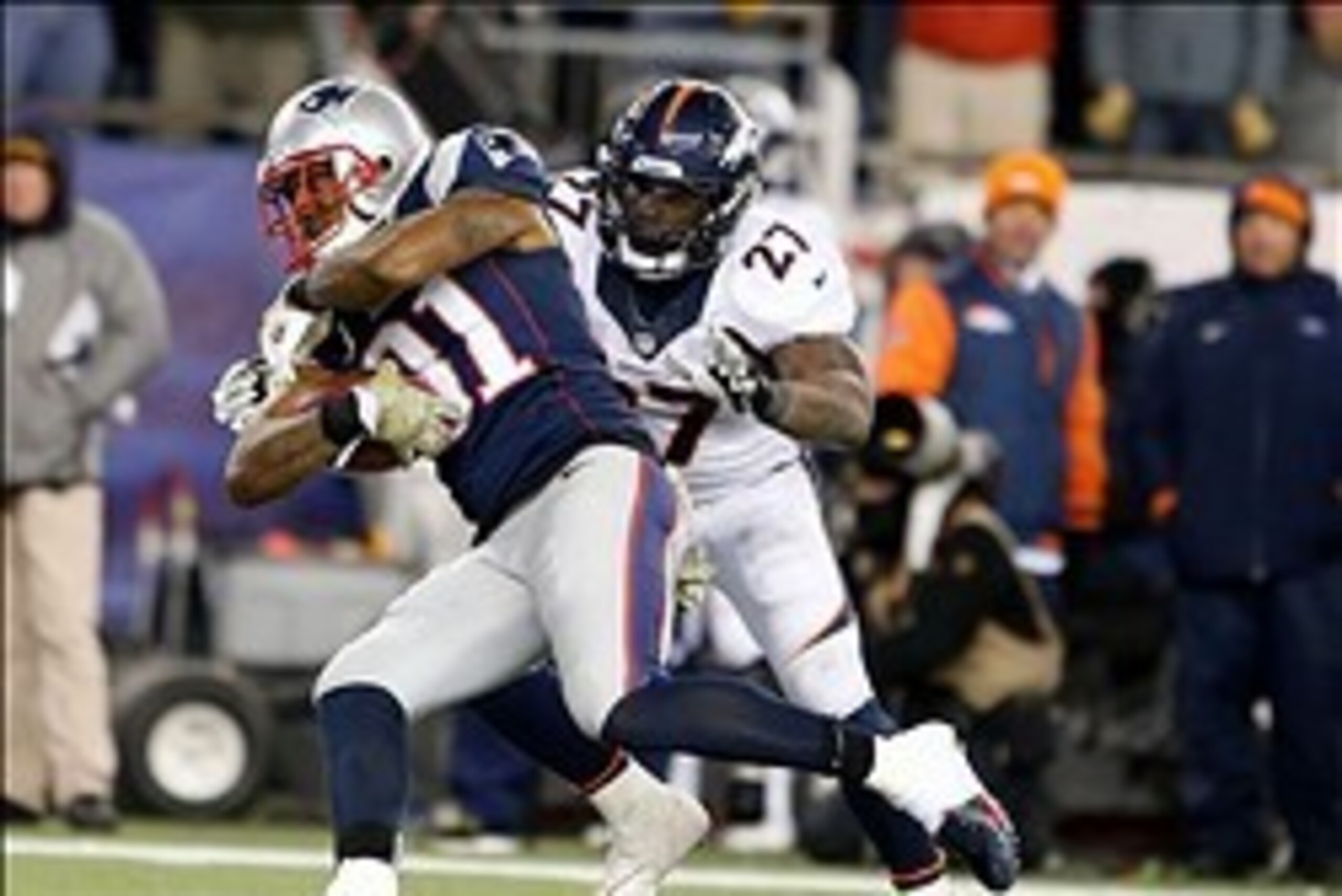 Nov 24, 2013; Foxborough, MA, USA; New England Patriots cornerback Aqib Talib (31) intercepts a pass intended for Denver Broncos running back Knowshon Moreno (27) in the fourth quarter at Gillette Stadium. The New England Patriots defeated the Denver Bron