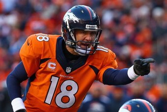 DENVER, CO - JANUARY 12:   Peyton Manning #18 of the Denver Broncos calls a play during the AFC Divisional Playoff Game against the San Diego Chargers at Sports Authority Field at Mile High on January 12, 2014 in Denver, Colorado.  (Photo by Doug Pensinge