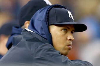 NEW YORK, NY - SEPTEMBER 26:  Alex Rodriguez #13 of the New York Yankees looks on from the dugout in the eighth inning against the Tampa Bay Rays on September 26, 2013 at Yankee Stadium in the Bronx borough of New York City.  (Photo by Elsa/Getty Images)