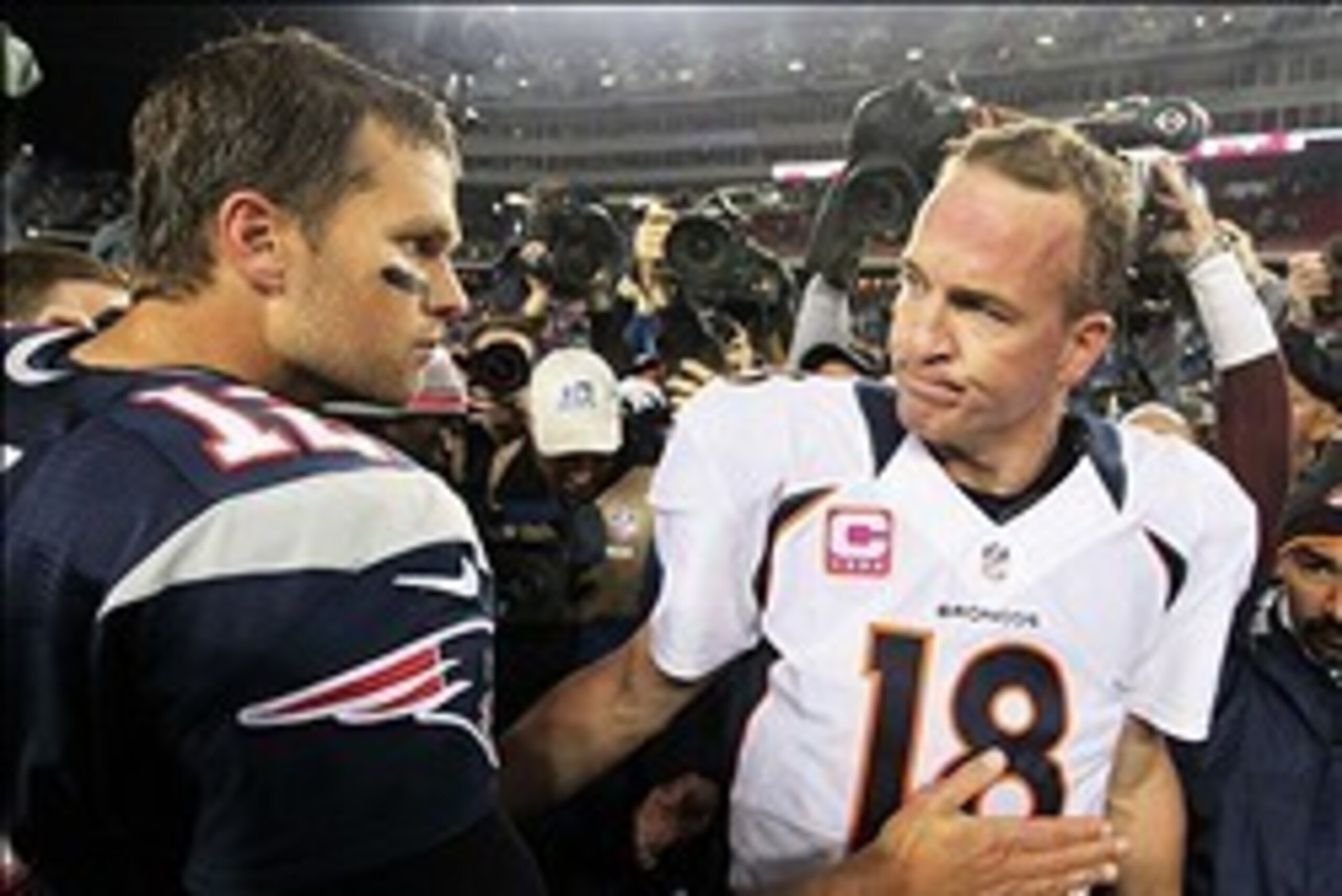 Oct 7, 2012; Foxborough, MA, USA; New England Patriots quarterback Tom Brady (12) shakes hands with Denver Broncos quarterback Peyton Manning (18) following the game at Gillette Stadium. The Patriots defeated the Broncos 31-21. Mandatory Credit: Stew Miln