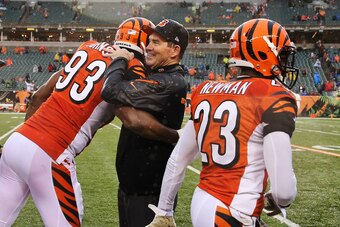 Nov 17, 2013; Cincinnati, OH, USA; Cincinnati Bengals defensive end Michael Johnson (93) hugs defensive coordinator Mike Zimmer during the game against the Cleveland Browns at Paul Brown Stadium. Cincinnati won 41-20. Mandatory Credit: Kevin Jairaj-USA TO