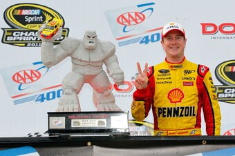 DOVER, DE - OCTOBER 02:  Kurt Busch, driver of the #22 Shell/Pennzoil Dodge, celebrates with the trophy in victory lane after winning the NASCAR Sprint Cup Series AAA 400 at Dover International Speedway on October 2, 2011 in Dover, Delaware.  (Photo by Ge