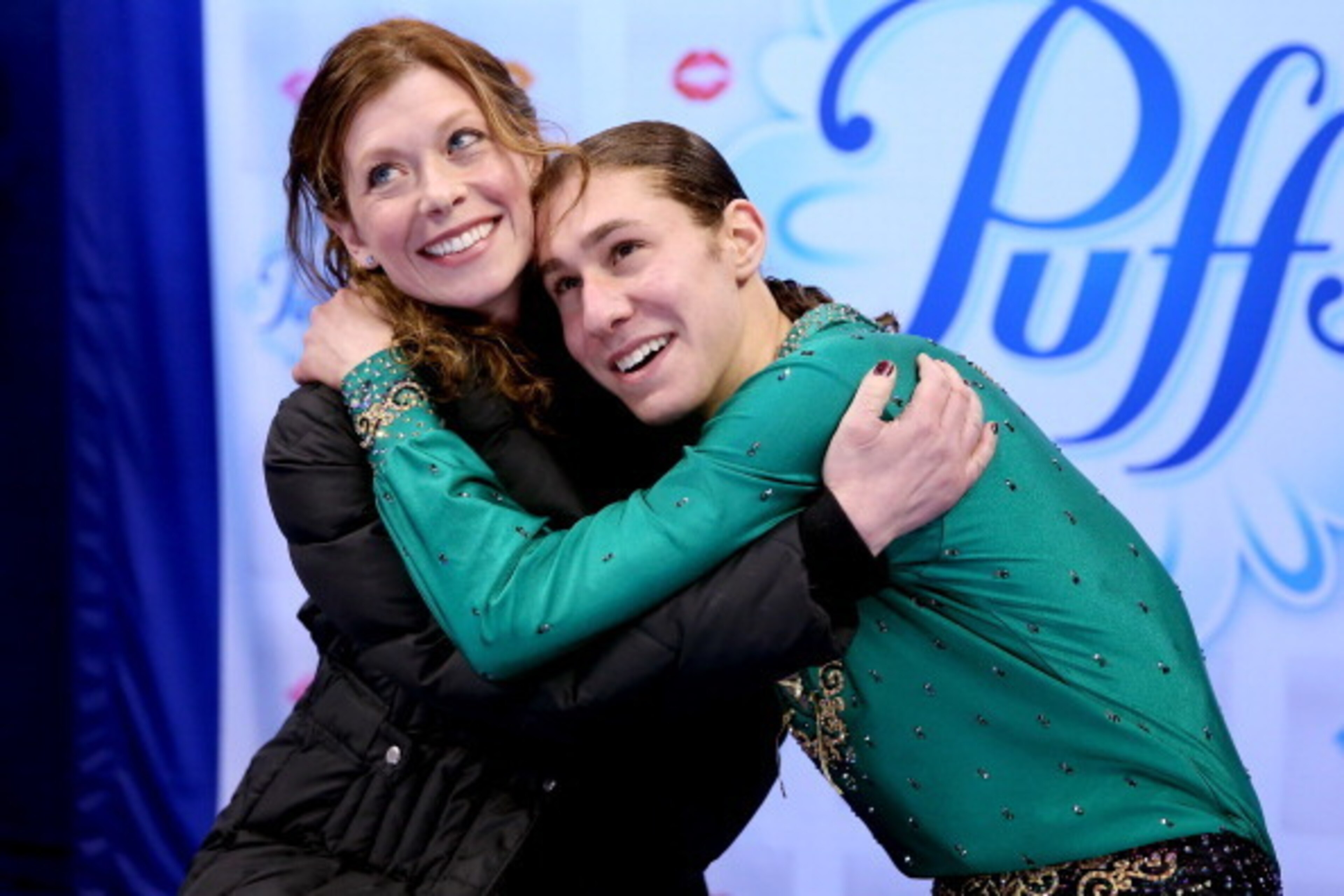 BOSTON, MA - JANUARY 12: Jason Brown, with his coach Kori Ade, celebrates in the kiss and cry after skating in the free skate during the Prudential U.S. Figure Skating Championships at TD Garden on January 12, 2014 in Boston, Massachusetts. (Photo by Ma BOSTON, MA - JANUARY 12: Jason Brown, with his coach Kori Ade, celebrates in the kiss and cry after skating in the free skate during the Prudential U.S. Figure Skating Championships at TD Garden on January 12, 2014 in Boston, Massachusetts. (Photo by Ma