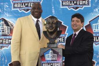 CANTON, OH - AUGUST 2: Fred Dean (left) and former owner Eddie DeBartolo Jr. of the San Francisco 49ers pose with Dean's bust during  the Class of 2008 Pro Football Hall of Fame Enshrinement Ceremony at Fawcett Stadium on August 2, 2008 in Canton, Ohio.  