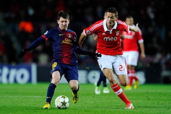 BARCELONA, SPAIN - DECEMBER 05:  Lionel Messi of FC Barcelona duels for the ball with Nemanja Matic of SL Benfica during the UEFA Champions League Group G match between FC Barcelona and SL Benfica at Nou Camp on December 5, 2012 in Barcelona, Spain.  (Pho