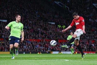 MANCHESTER, ENGLAND - APRIL 22:  Robin van Persie of Manchester United scores his team's second goal during the Barclays Premier League match between Manchester United and Aston Villa at Old Trafford on April 22, 2013 in Manchester, England.  (Photo by Al