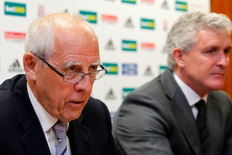 STOKE-ON-TRENT, ENGLAND - MAY 30: Stoke City owner Peter Coates (L) speaks during a press conference at the Clayton Wood Training Ground on May 30, 2013 in Stoke-on-Trent, England. (Photo by Paul Thomas/Getty Images)