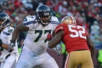 December 8, 2013; San Francisco, CA, USA; Seattle Seahawks guard James Carpenter (77) blocks San Francisco 49ers inside linebacker Patrick Willis (52) during the fourth quarter at Candlestick Park. The 49ers defeated the Seahawks 19-17. Mandatory Credit: 
