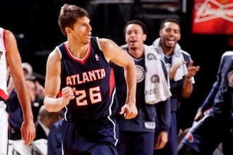 PORTLAND, OR - NOVEMBER 12: Kyle Korver #26 of the Atlanta Hawks is cheered on by teammates after making a three-pointer against the Portland Trail Blazers on November 12, 2012 at the Rose Garden Arena in Portland, Oregon. NOTE TO USER: User expressly ack