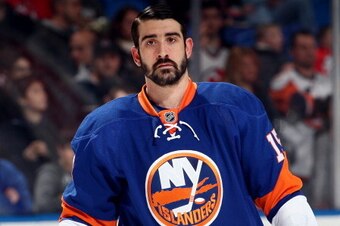 UNIONDALE, NY - DECEMBER 28:  Cal Clutterbuck #15 of the New York Islanders looks on prior to a game against the New Jersey Devils at the Nassau Veterans Memorial Coliseum on December 28, 2013 in Uniondale, New York.  (Photo by Alex Trautwig/Getty Images)