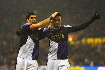 STOKE ON TRENT, ENGLAND - JANUARY 12:  Daniel Sturridge of Liverpool (R) celebrates with Luis Suarez as he scores their fifth goal during the Barclays Premier League match between Stoke City and Liverpool at Britannia Stadium on January 12, 2014 in Stoke 