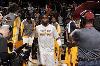 CLEVELAND, OH - DECEMBER 26:  Kyrie Irving #2 of the Cleveland Cavaliers runs out before the game against the Atlanta Hawks at The Quicken Loans Arena on December 26, 2013 in Cleveland, Ohio. NOTE TO USER: User expressly acknowledges and agrees that, by d