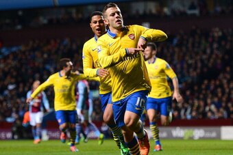 BIRMINGHAM, ENGLAND - JANUARY 13:  Jack Wilshere of Arsenal ceelbrates scoring the opening goal with Serge Gnabry of Arsenal during the Barclays Premier League match between Aston Villa and Arsenal at Villa Park on January 13, 2014 in Birmingham, England.