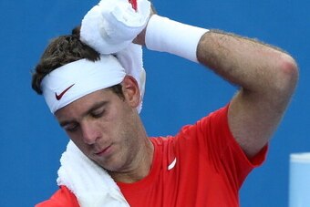 MELBOURNE, AUSTRALIA - JANUARY 14:  Juan Martn Del Potro of Argentina feels the heat in his first round match against Rhyne Williams of the United States during day two of the 2014 Australian Open at Melbourne Park on January 14, 2014 in Melbourne, Austra
