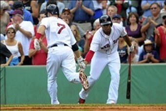 Sep 1, 2013; Boston, MA, USA; Boston Red Sox shortstop Stephen Drew (7) gets a low five from third baseman Xander Bogaerts (72) after hitting a home run during the third inning against the Chicago White Sox at Fenway Park. Mandatory Credit: Bob DeChiara-U
