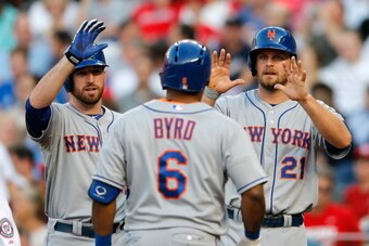 WASHINGTON, DC - JUNE 05: Ike Davis #29 (L) and Lucas Duda #21 wait at the plate to greet Marlon Byrd #6 of the New York Mets after hitting a two RBI home run in the second inning against the Washington Nationals at Nationals Park on June 5, 2013 in Washi