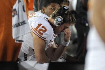 PASADENA, CA - JANUARY 07:  Quarterback Colt McCoy #12 of the Texas Longhorns looks on during the sideline in the fourth quarter against the Alabama Crimson Tide in the Citi BCS National Championship game at the Rose Bowl on January 7, 2010 in Pasadena, C