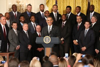 WASHINGTON, DC - JANUARY 14:  U.S. President Barack Obama (C) welcomes the 2012-2013 National Basketball Association champion Miami Heat to the White House for a visit on January 14, 2014 in Washington, DC. NOTE TO USER: User expressly acknowledges and ag