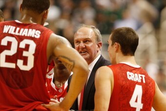 EAST LANSING, MI - JANUARY 07:  Thad Matta head coach of the Ohio State Buckeyes talks to Aaron Craft #4 and Lenzelle Smith Jr. #32 during a second half time out while playing the Michigan State Spartans at the Jack T. Breslin Student Events Center on Jan