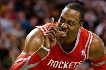 Jan 13, 2014; Boston, MA, USA; Houston Rockets power forward Dwight Howard (12) gestures at a fan during the second half of Houston's 104-92 win over the Boston Celtics at TD Garden. Mandatory Credit: Winslow Townson-USA TODAY Sports
