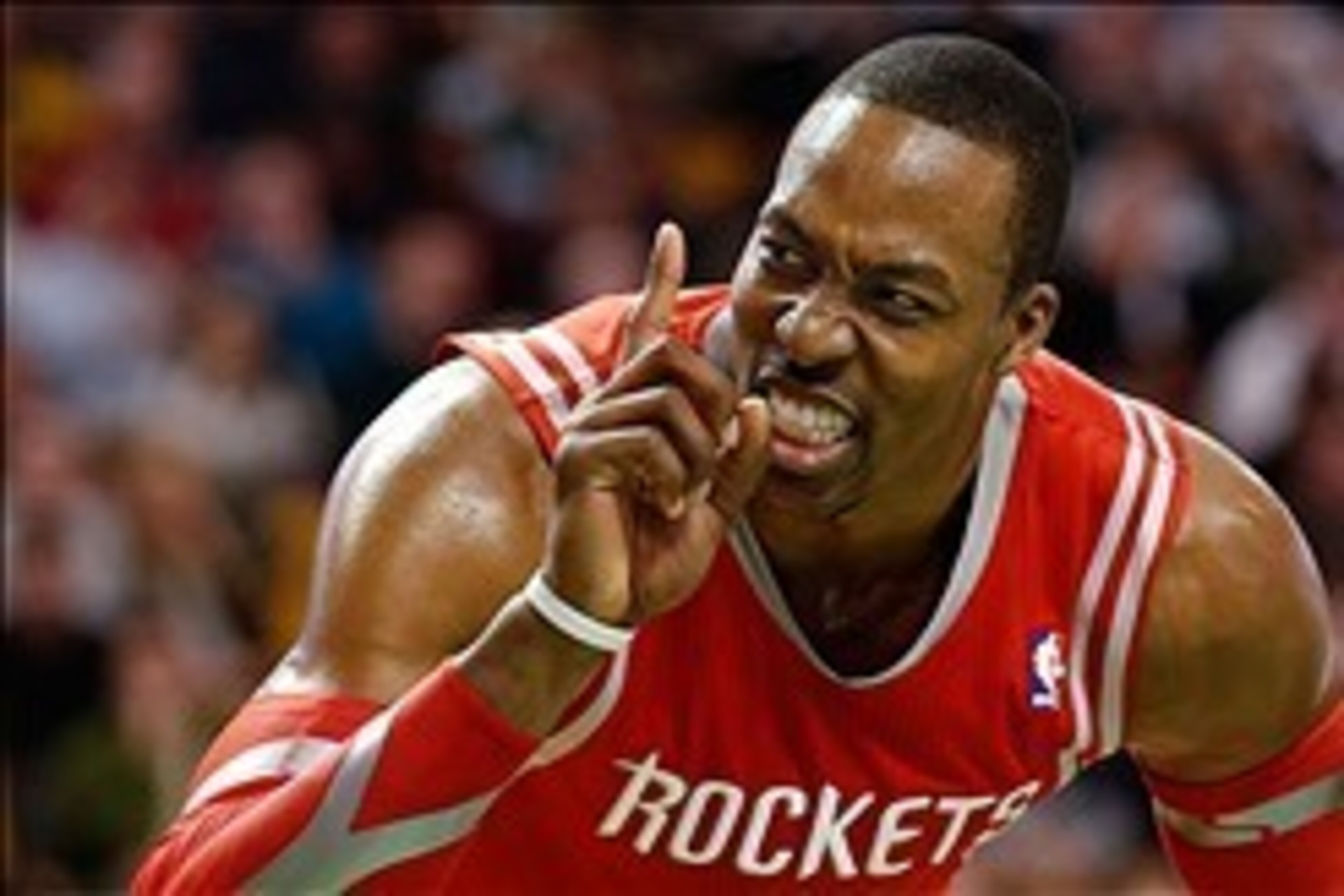 Jan 13, 2014; Boston, MA, USA; Houston Rockets power forward Dwight Howard (12) gestures at a fan during the second half of Houston's 104-92 win over the Boston Celtics at TD Garden. Mandatory Credit: Winslow Townson-USA TODAY Sports
