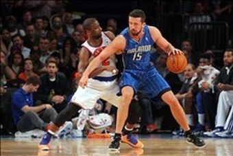 January 30, 2013; New York, NY, USA; Orlando Magic forward Hedo Turkoglu (15) is defended by New York Knicks guard Raymond Felton (2) during the third quarter of an NBA game at Madison Square Garden. Mandatory Credit: Brad Penner-USA TODAY Sports