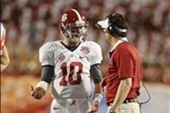 Jan 7, 2013; Miami, FL, USA; Alabama Crimson Tide quarterback A.J. McCarron (10) talks with quarterbacks coach Doug Nussmeier during a timeout against the Notre Dame Fighting Irish during the 2013 BCS Championship game at Sun Life Stadium. Alabama won 42-