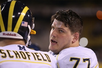 TEMPE, AZ - DECEMBER 28:  Offensive linesman Taylor Lewan #77 of the Michigan Wolverines on the sidelines during the Buffalo Wild Wings Bowl against the Kansas State Wildcats at Sun Devil Stadium on December 28, 2013 in Tempe, Arizona. The Wildcats defeat