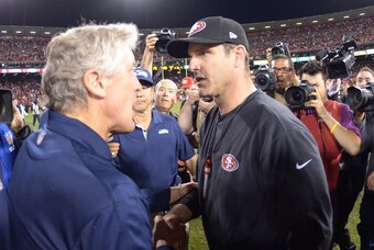 Oct 18, 2012; San Francisco, CA, USA; Seattle Seahawks coach Pete Carroll (left) shakes hands with San Francisco 49ers coach Jim Harbaugh after the game at Candlestick Park. The 49ers defeated the Seahawks 13-6.  Mandatory Credit: Kirby Lee/Image of Sport