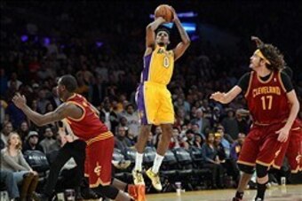 Jan 14, 2014; Los Angeles, CA, USA; Cleveland Cavaliers center Anderson Varejao (17) looks on as Los Angeles Lakers small forward Nick Young (0) goes for a last second shot in the fourth quarter of the game at Staples Center. Cleveland Cavaliers won 120-1