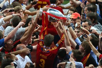 Pique holds the Euro 2012 trophy aloft