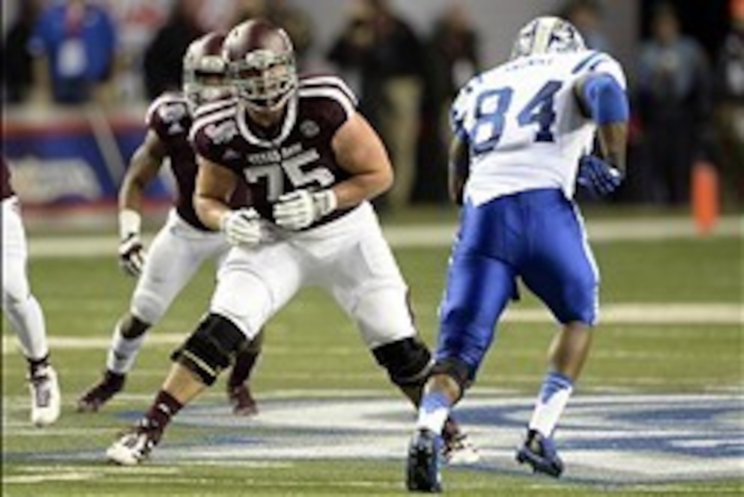 Dec 31, 2013; Atlanta, GA, USA; Texas A&M Aggies offensive linesman Jake Matthews (75) sets to pass block Duke Blue Devils defensive end Kenny Anunike (84) during the second quarter in the 2013 Chick-fil-a Bowl at the Georgia Dome. Mandatory Credit: John 
