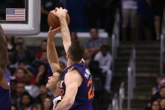 LOS ANGELES, CA - DECEMBER 30:  Miles Plumlee #22 of the Phoenix Suns blocks a shot by Blake Griffin #32 of  the Los Angeles Clippers at Staples Center on December 30, 2013 in Los Angeles, California. NOTE TO USER: User expressly acknowledges and agrees t