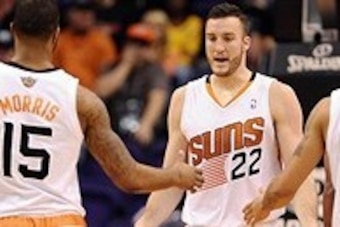 Dec 23, 2013; Phoenix, AZ, USA; Phoenix Suns forward Miles Plumlee (22) is congratulated by teammate forward Marcus Morris (15) in the first half against the Los Angeles Lakers at US Airways Center.  The Suns won 117-90. Mandatory Credit: Jennifer Stewart