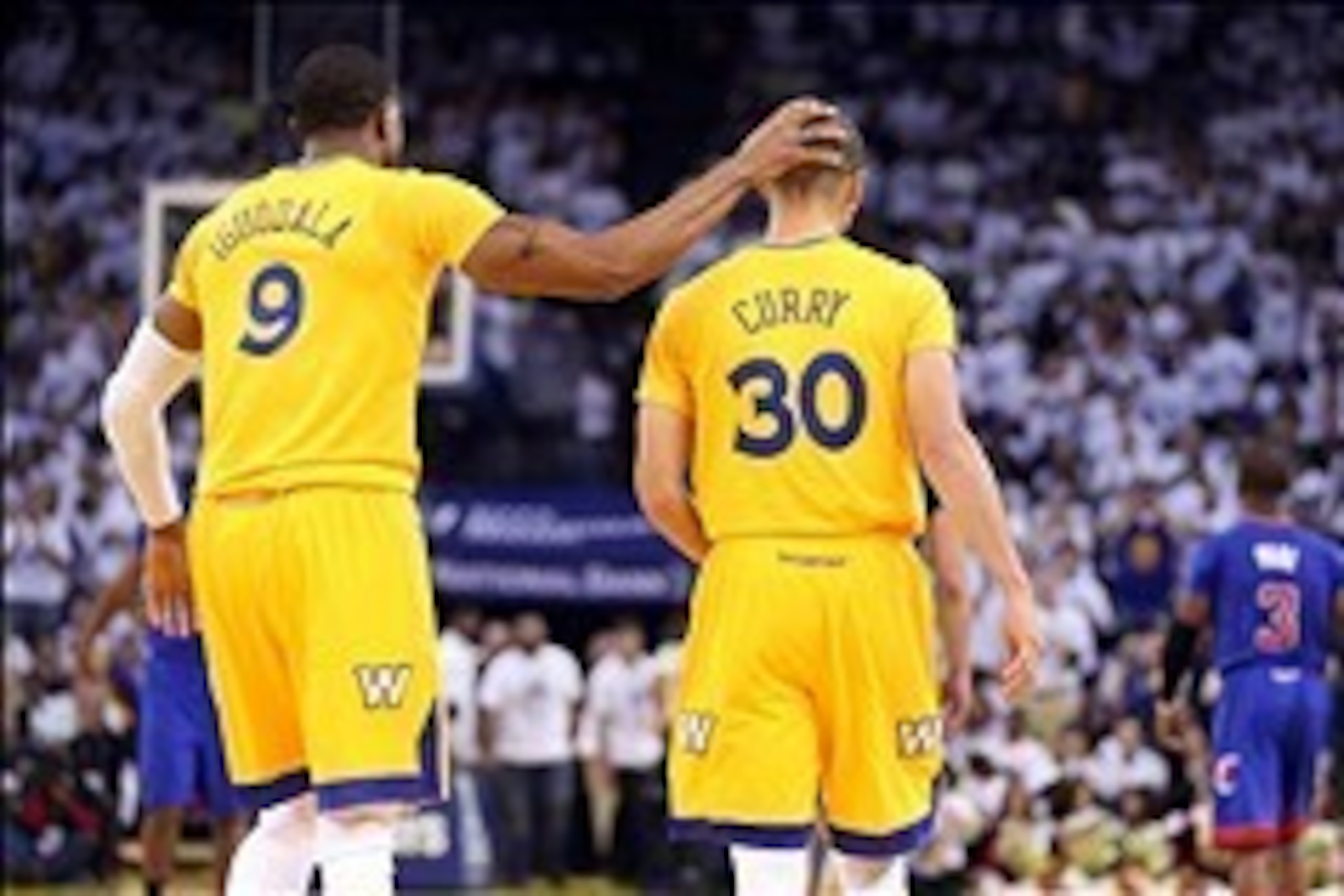 Dec 25, 2013; Oakland, CA, USA; Golden State Warriors small forward Andre Iguodala (9) celebrates with point guard Stephen Curry (30) after drawing a charge for an offensive foul against Los Angeles Clippers point guard Chris Paul (3) during the second qu