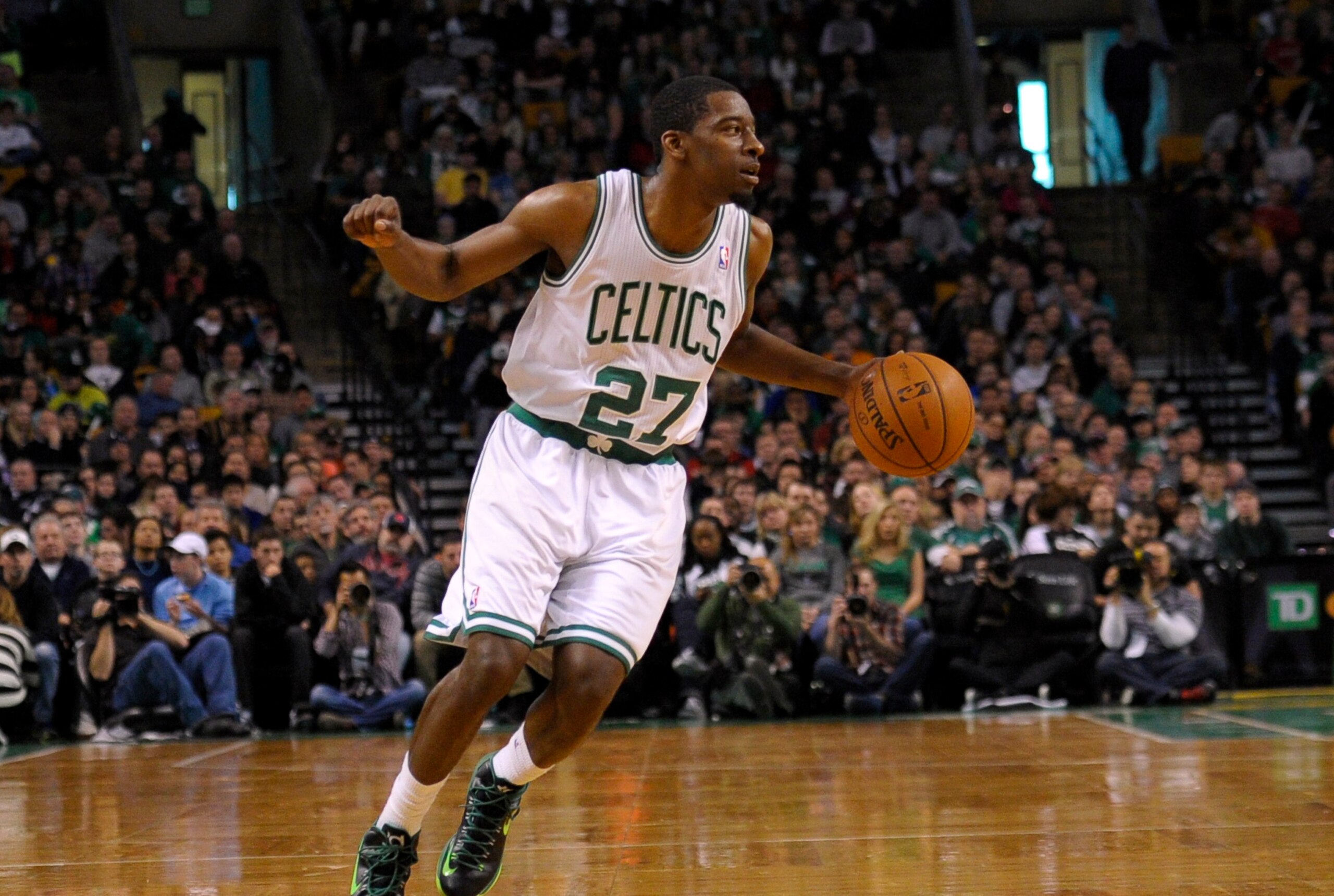 Dec 28, 2013; Boston, MA, USA; Boston Celtics shooting guard Jordan Crawford (27) dribbles the ball during the second half against the Cleveland Cavaliers at TD Garden. Mandatory Credit: Bob DeChiara-USA TODAY Sports