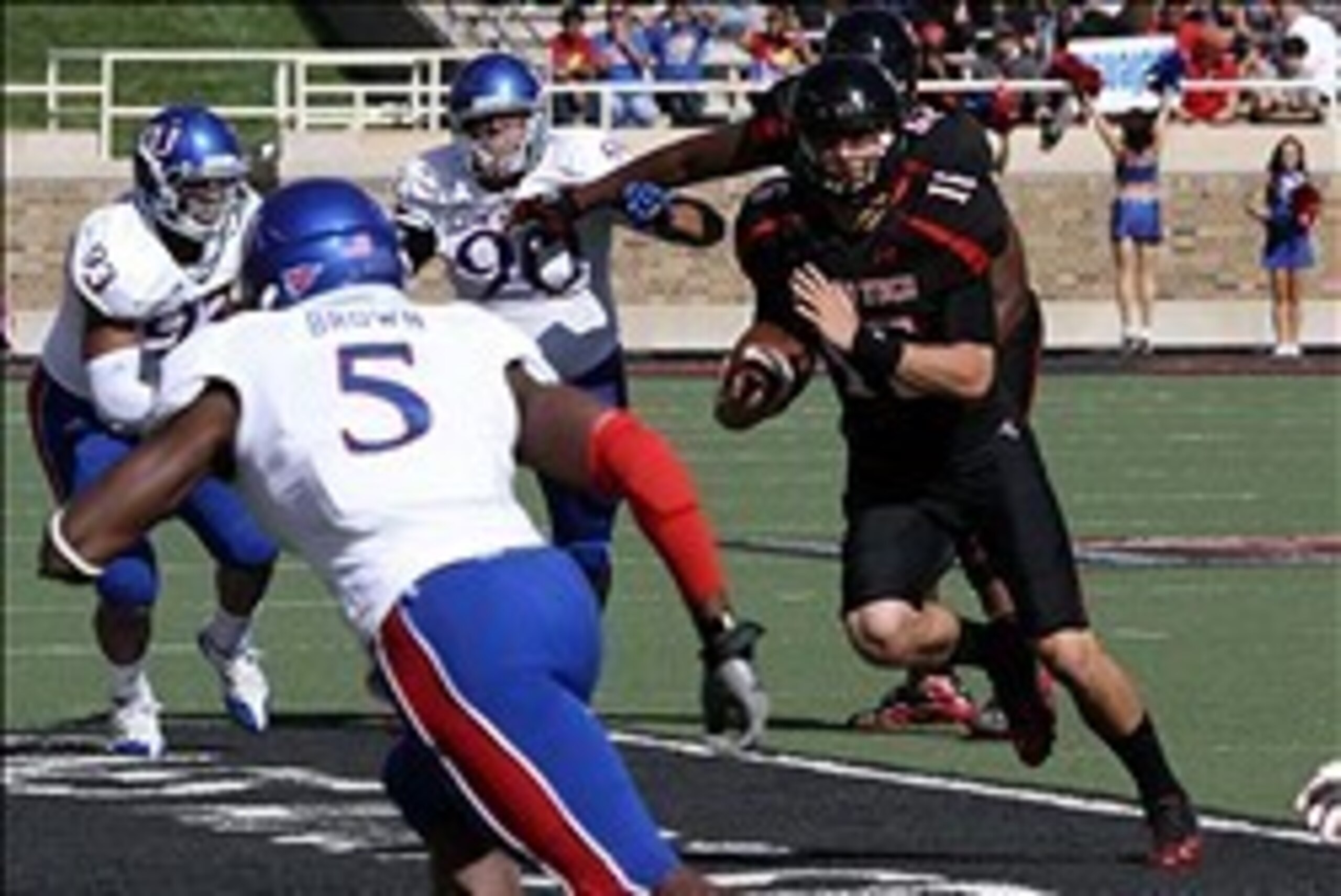 Nov 10, 2012; Lubbock, TX, USA; Texas Tech Red Raiders quarter back Michael Brewer (16) rushes against the Kansas Jayhawks in the first half at Jones AT&T Stadium. Mandatory Credit: Michael C. Johnson-USA TODAY Sports