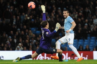 MANCHESTER, ENGLAND - JANUARY 15:  Alvaro Negredo of Manchester City scores the second goal past Simon Eastwood of Blackburn Rovers during the Budweiser FA Cup Third Round Replay match between Manchester City and Blackburn Rovers at the Etihad Stadium on 
