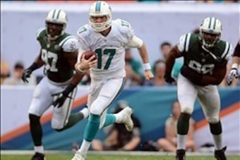 Dec 29, 2013; Miami Gardens, FL, USA; Miami Dolphins quarterback Ryan Tannehill (17) breaks free as New York Jets outside linebacker Calvin Pace (97) and linebacker Quinton Coples (98) chase during the second half of the game at Sun Life Stadium. The Jets Dec 29, 2013; Miami Gardens, FL, USA; Miami Dolphins quarterback Ryan Tannehill (17) breaks free as New York Jets outside linebacker Calvin Pace (97) and linebacker Quinton Coples (98) chase during the second half of the game at Sun Life Stadium. The Jets