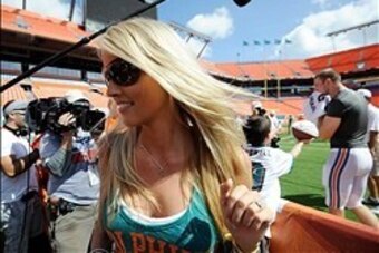 Aug. 4, 2012; Miami, FL, USA; Lauren Ufer (left) the wife of Miami Dolphins quarterback Ryan Tannehill (right) leaves field after a teams scrimmage at Sun Life Stadium. Mandatory Credit: Steve Mitchell-USA TODAY Sports Aug. 4, 2012; Miami, FL, USA; Lauren Ufer (left) the wife of Miami Dolphins quarterback Ryan Tannehill (right) leaves field after a teams scrimmage at Sun Life Stadium. Mandatory Credit: Steve Mitchell-USA TODAY Sports