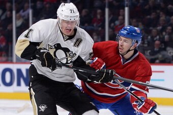 MONTREAL, QC - NOVEMBER 23: Alexei Emelin #74 of the Montreal Canadiens and Evgeni Malkin #71 of the Pittsburgh Penguins battle for position during the NHL game on November 23, 2013 at the Bell Centre in Montreal, Quebec, Canada. (Photo by Francois Lacass