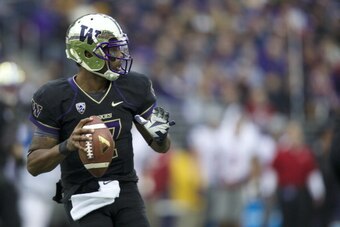 SEATTLE, WA - NOVEMBER 29: Keith Price #17 of Washington looks to pass during the first half of a game against Washington State at Husky Stadium on November 29, 2013 in Seattle, Washington. (Photo by Stephen Brashear/Getty Images)