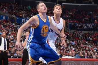LOS ANGELES, CA - OCTOBER 31: David Lee #10 of the Golden State Warriors attempts to box out Blake Griffin #32 of the Los Angeles Clippers at STAPLES Center on October 31, 2013 at in Los Angeles, California. NOTE TO USER: User expressly acknowledges and a