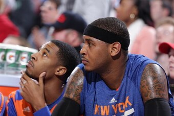 PORTLAND, OR - NOVEMBER 25:  Carmelo Anthony #7 of the New York Knicks sits on the bench against the Portland Trail Blazers on November 25, 2013 at the Moda Center Arena in Portland, Oregon. NOTE TO USER: User expressly acknowledges and agrees that, by do