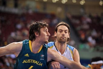 BEIJING - AUGUST 12:  Andrew Bogut #6 and Fabricio Oberto #7 of Argentina battle for the rebound during the game against Australia at the 2008 Beijing Summer Olympics on August 12, 2008 at the Beijing Olympic Basketball Gymnasium in Beijing, China.  Argen