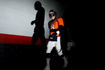 DENVER, CO - DECEMBER 12:   Peyton Manning #18 of the Denver Broncos prepares for their game against the San Diego Chargers at Sports Authority Field at Mile High on December 12, 2013 in Denver, Colorado.  (Photo by Justin Edmonds/Getty Images)