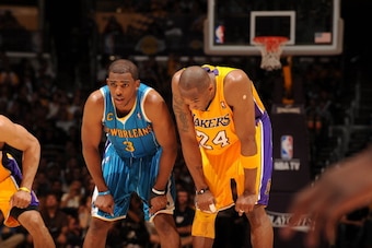 LOS ANGELES, CA - APRIL 26: Chris Paul #3 of the New Orleans Hornets and Kobe Bryant #24 of the Los Angeles Lakers rest during a break in Game Five of the Western Conference Quarterfinals in the 2011 NBA Playoffs at Staples Center on April 26, 2011 in Lo LOS ANGELES, CA - APRIL 26: Chris Paul #3 of the New Orleans Hornets and Kobe Bryant #24 of the Los Angeles Lakers rest during a break in Game Five of the Western Conference Quarterfinals in the 2011 NBA Playoffs at Staples Center on April 26, 2011 in Lo